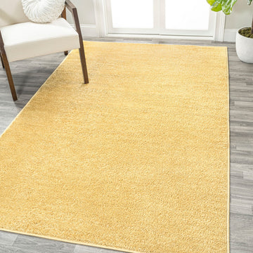 Haze Solid Low-pile Area Rug Mustard